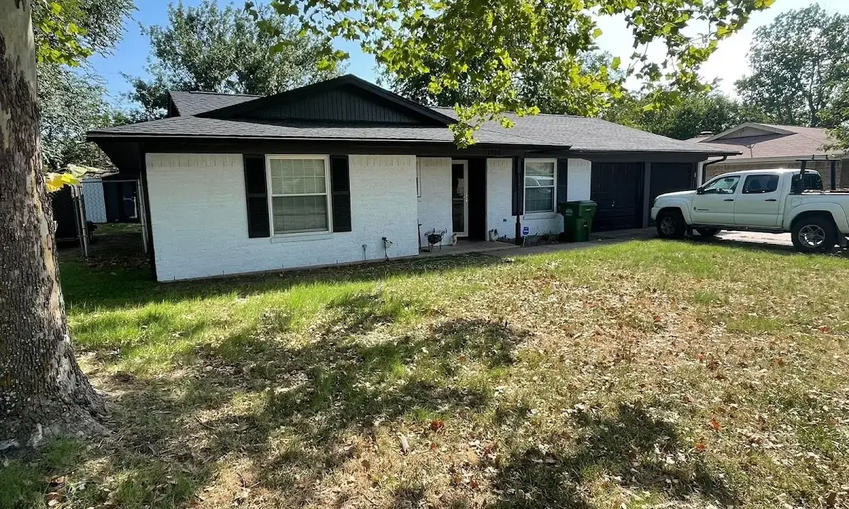 Professional roofing crew working on a residential roof in Pleasanton